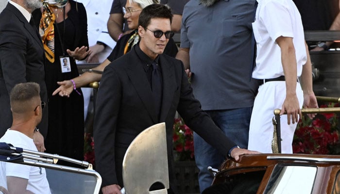 US football player Tom Brady leaves the Gritti Palace Hotel on the wedding day of Amazon founder Jeff Bezos with Lauren Sanchez, in Venice on June 27, 2025. — AFP