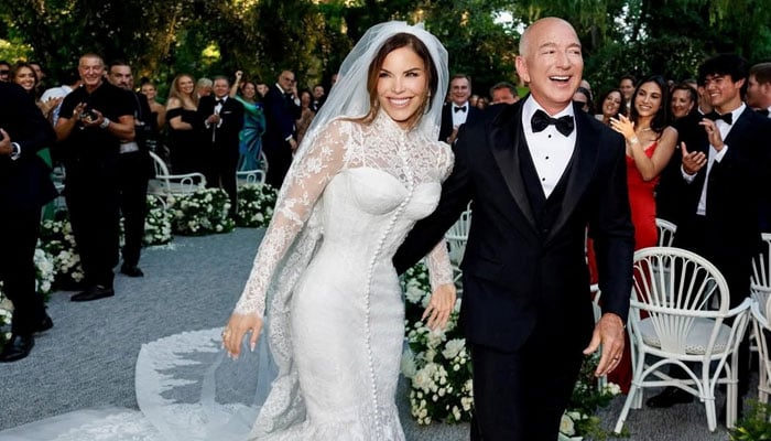Amazon Founder Jeff Bezos and Media Personality Lauren Sanchez Bezos react on the day of their wedding in Venice, Italy, June 27, 2025 in this picture obtained from social media. — Reuters