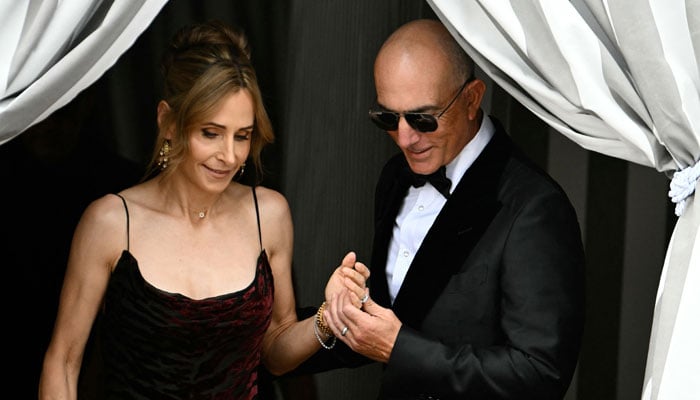 Lisa Bezos and Mark Bezos, half-brother of Amazons founder Jeff Bezos, leaves the Aman Hotel on the wedding day of Jeff Bezos with Lauren Sanchez in Venice on June 27, 2025. — AFP