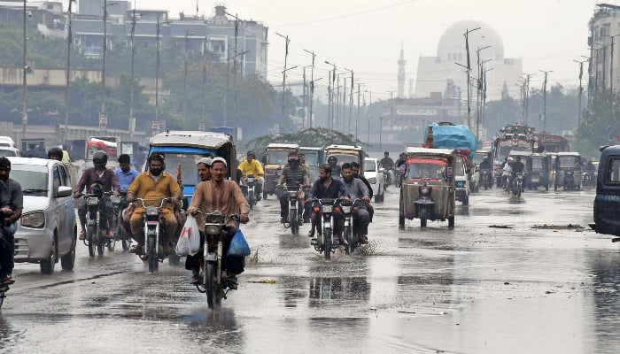 Motorists on their way after the heavy rainfall in Karachi on June 27, 2025. — Online