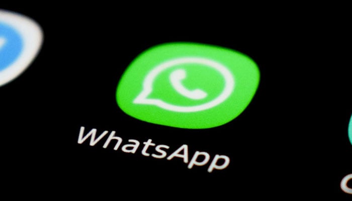 This representational image shows the WhatsApp icon displayed on a phone screen. — Unsplash