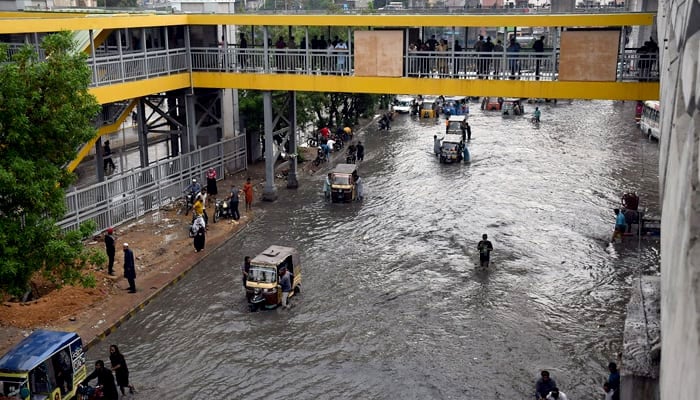 Rainwater accumulates on Karachi road in this undated image. — APP/File