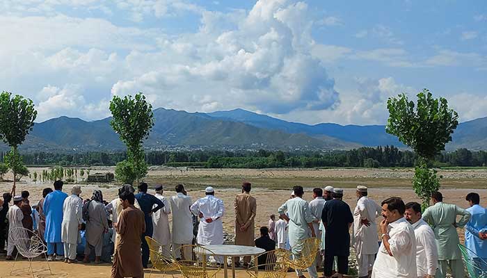 Residents gather, after tourists, who were on a picnic, were swept away by overflowing floodwaters in the Swat River, in Swat Valley, Khyber Pakhtunkhwa, June 27, 2025. — Reuters