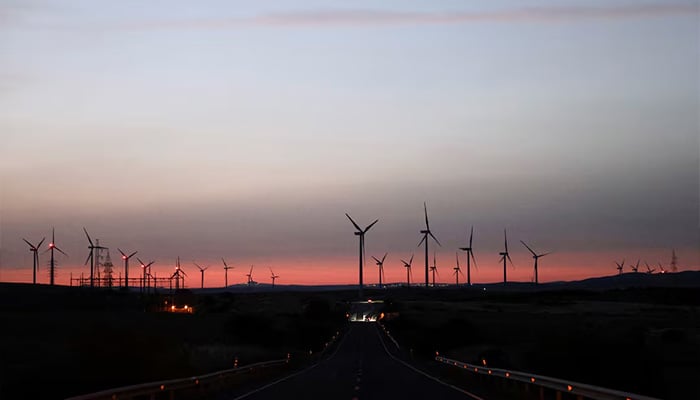 Wind turbines spin in front of the Atlantic Ocean near Zahara de los Atunes, Spain May 27, 2025. — Reuters