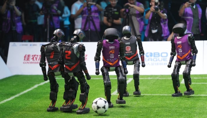 Humanoid robots can be seen playing football in Beijing, China. —X/@DailyBeijing