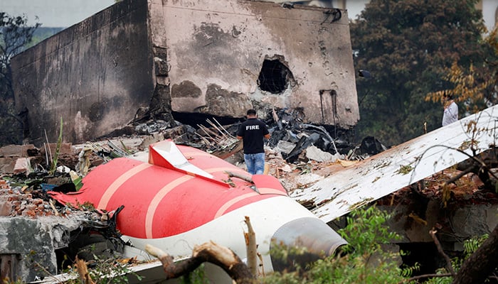 A fire officer stands next to the crashed Air India Boeing 787-8 Dreamliner aircraft, in Ahmedabad, India. — Reuters/File