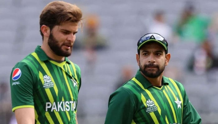 Haris Rauf (R) talks to Shaheen Shah Afridi during the ICC mens Twenty20 World Cup 2022 cricket match between Pakistan and Netherlands at the Perth Stadium on October 30, 2022 in Perth. - AFP