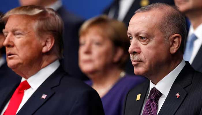 US President Donald Trump and Turkiyes President Tayyip Erdogan pose for a family photo during the annual NATO heads of government summit at the Grove Hotel in Watford, Britain December 4, 2019. — Reuters