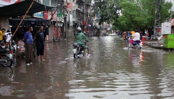 Commuters are facing difficulties due to stagnant rainwater caused by downpour of monsoon season at McLeod road in Lahore on June 29, 2025. — PPI