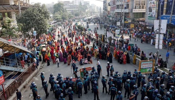 Garment industry workers block a road during a protest demanding a wage raise, in the Mirpur area of Dhaka, Bangladesh, November 12, 2023. — Reuters