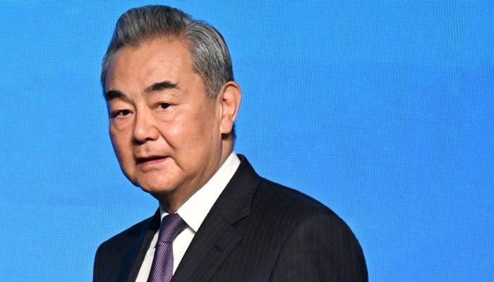Chinas Foreign Minister Wang Yi leaves the podium after signing a document at the signing ceremony of the Convention on the Establishment of the International Organisation for Mediation Convention (IOMed) in Hong Kong on May 30, 2025. — AFP