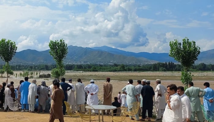 Residents gather, after tourists, who were on a picnic, were swept away by overflowing floodwaters in the Swat River, in Swat Valley in Pakistan June 27, 2025. — Reuters