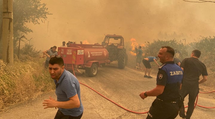 Firefighters and local residents respond to a wildfire in Menderes district of the Aegean city of Izmir, Turkey, June 29, 2025. — Reuters