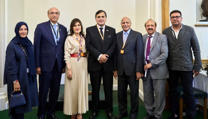 British-Pakistani billionaire and philanthropist Sir Anwar Pervez (third from right) poses for a group photo. — Reporter