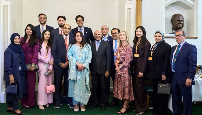 British-Pakistani billionaire and philanthropist Sir Anwar Pervez (sixth from right) poses for a group photo. — Reporter