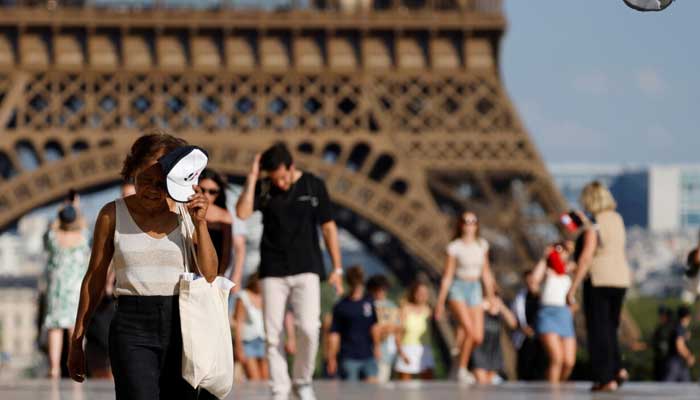 People walk in heatwave in Paris, France. — AFP/File