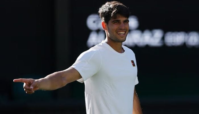 Spains Carlos Alcaraz celebrates winning his first round match against Italys Fabio Fognini, Wimbledon, All England Lawn Tennis and Croquet Club, London, Britain, June 30, 2025. — Reuters