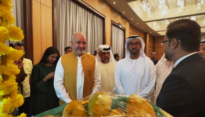 Diplomats and dignitaries, including Pakistan Ambassador Faisal Niaz Tirmizi (center in yellow vest) and UAE’s Sheikh Mubarak bin Sultan Al Nahyan (in white kandura), inaugurate the Pakistani Mango Festival in Abu Dhabi, celebrating the sweet success of mango diplomacy. — Reporter