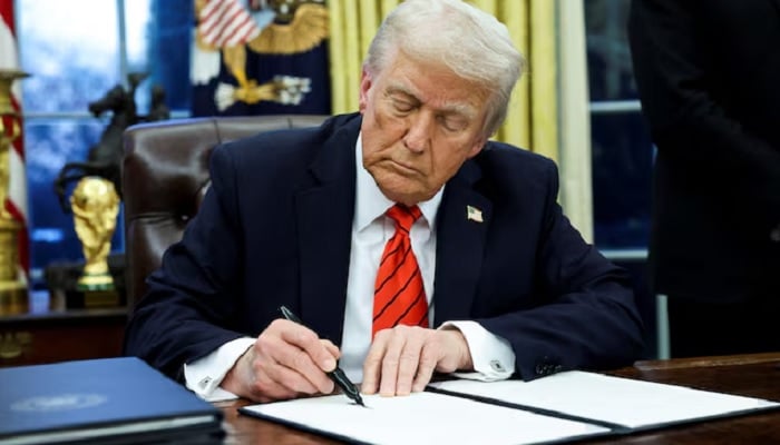 President Donald Trump signs an executive order in the Oval Office of the White House in Washington, US, February 10, 2025.— Reuters