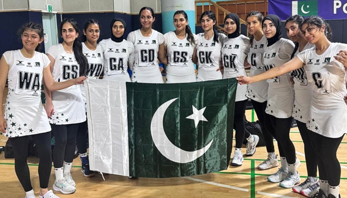 Pakistans national netball team poses with the national flag after winning the Asian Youth Girls Netball Championship 2025 final (Plate Division Cup) by defeating Maldives at the Jeonju Hwasan Gymnasium, Jeonju, South Korea, on July 4, 2025. — Reporter
