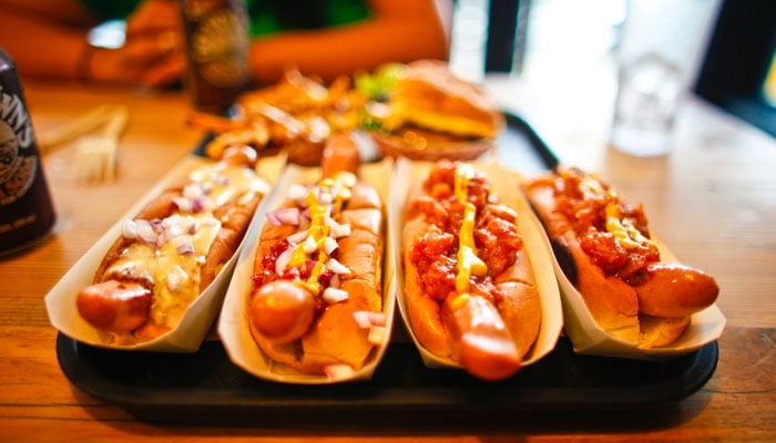 Hot dogs, a type of processed foods, can be seen in this image. — Pexels
