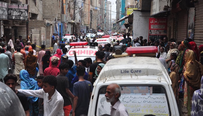 Ambulances at the site of the building that collapsed in the Baghdadi area of Lyari, Karachi, on July 4, 2025. — Geo News