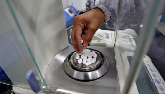 A pharmacist checks the weight of Paracetamol, a common pain reliever also sold as acetaminophen, tablets inside a lab of a pharmaceutical company on the outskirts of Ahmedabad, India, March 4, 2020. — Reuters