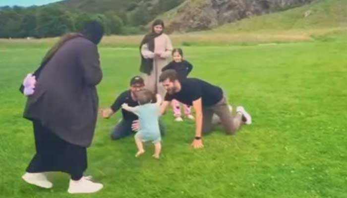 The image shows Shaheen Afridi celebrating his sons first steps with family. — Instagram@ishaheenafridi10