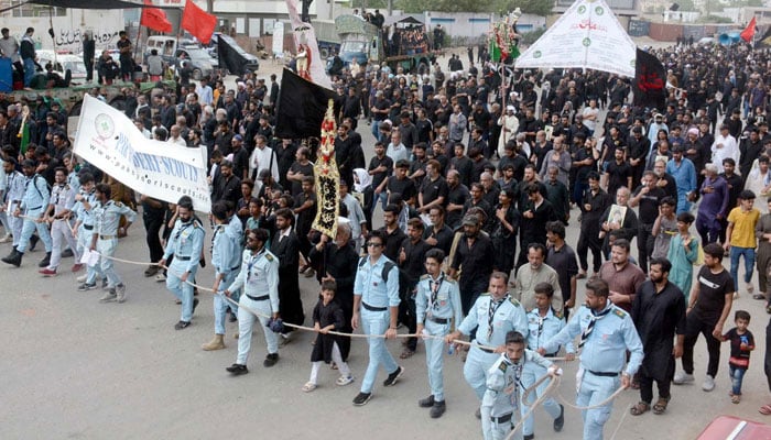 Mourners participate in Muharram 9 procession at MA Jinnah road in Karachi on July 5, 2025. — PPI