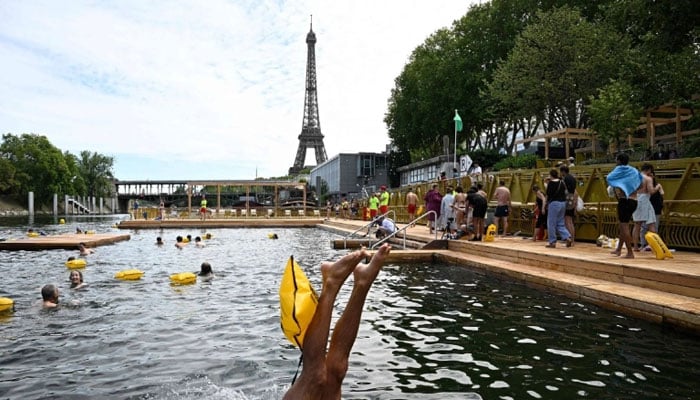 A swimmer dives in into the River Seine in Paris, France on July 5, 2025. — AFP