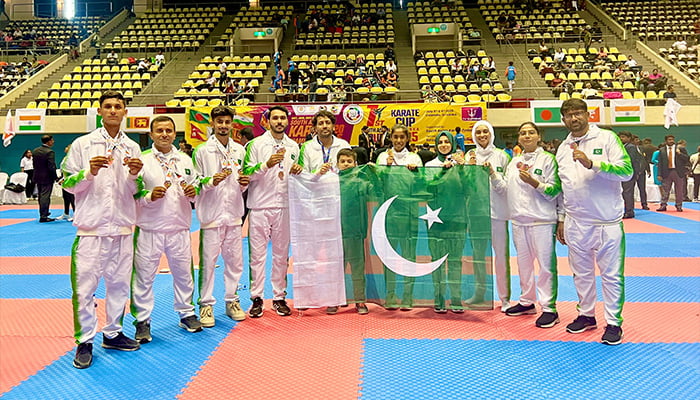 Pakistani karatekas pose for a group photo after winning gold, silver, and bronze medals at  South Asian Karate Championship 2025, Colombo, Sri Lanka. — Reporter
