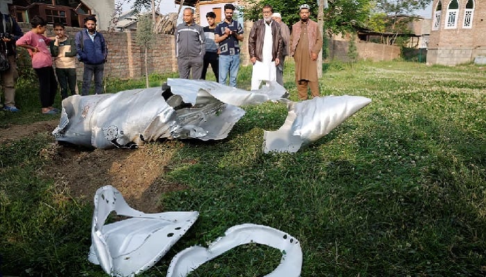 Metal debris lies on the ground in Wuyan in Indian Illegally Occupied Jammu & Kashmirs Pulwama district district May 7, 2025. —Reuters