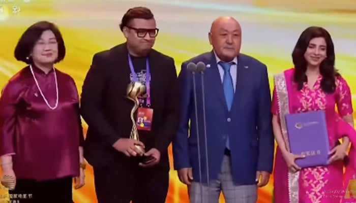 Deemak director Rafay Rashdi and lead actor Sonya Hussyn receive the award at Shanghai Cooperation Organisation (SCO) Film Festival 2025. — Screengrab via Instagram@rafayrashdi
