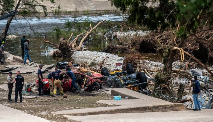 First responders attend to a vehicle pulled from the water in the aftermath of deadly flooding in Kerrville, Texas, U., July 6, 2025. —Reuters