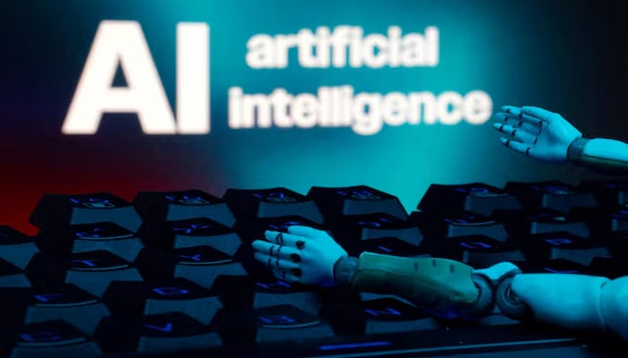 A message reading AI artificial intelligence, a keyboard, and robot hands are seen in this illustration taken January 27, 2025. — Reuters