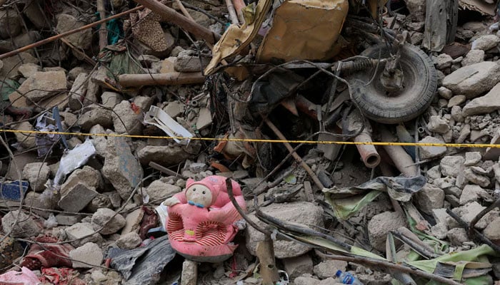 Personal belongings lie amid the rubble of a five-storey residential building that collapsed on Friday, July 4, in Karachi, Sindh July 7, 2025. — Reuters