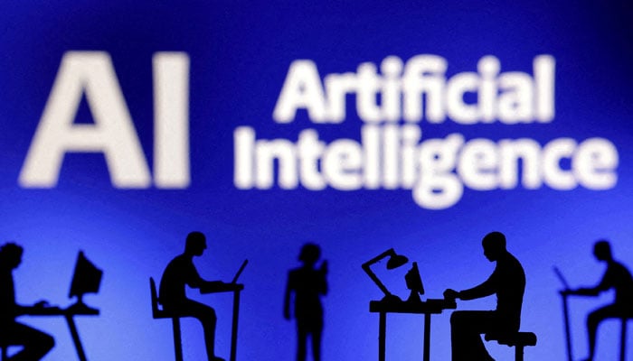 Figurines with computers and smartphones are seen in front of the words Artificial Intelligence AI in this illustration taken, February 19, 2024. — Reuters