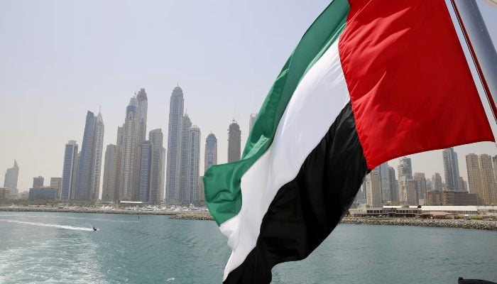 UAE flag flies over a boat at Dubai Marina, Dubai, United Arab Emirates, May 22, 2015. — Reuters