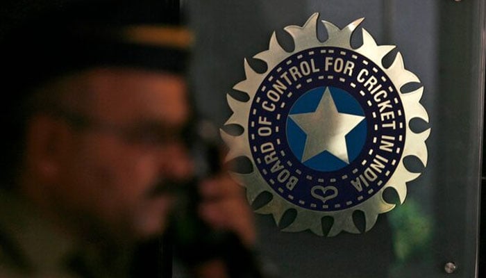 A policeman walks past a logo of the Board of Control for Cricket in India (BCCI) at BCCI headquarters in Mumbai, India. — Reuters/File