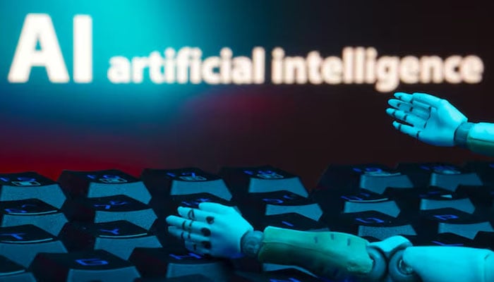 A message reading AI artificial intelligence, a keyboard, and robot hands are seen in this illustration taken on January 27, 2025. — Reuters