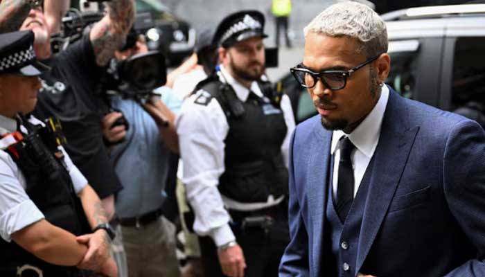 Chris Brown appears in UK court, pleads not guilty to lesser assault charge