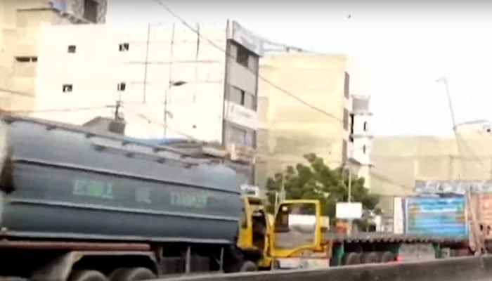 Vehicles are stuck in a traffic jam after residents of Punjab Colony stage a protest against prolonged power cuts on July 12, 2025. — Screengrab via GeoNews