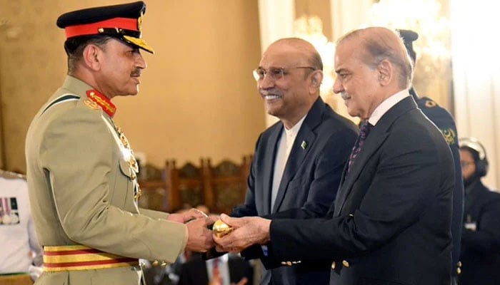 President Asif Ali Zardari (centre) Prime Minister Shehbaz Sharif (right) jointly confer baton of field marshal upon Chief of Army Staff Asim Munir on May 22, 2025. — X/ @MediaCellPPP