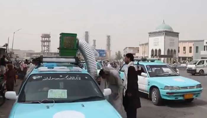 Afghanistan taxi drivers use handmade coolers to beat the heat. — AFP/File