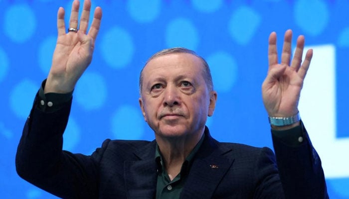 Turkish President Tayyip Erdogan greets the audience before addressing the members of his ruling AK Party in Ankara on July 12, 2025. — Reuters