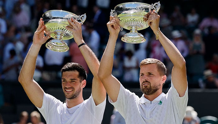 Britains Lloyd Glasspool and Julian Cash celebrate with their trophies after winning the Wimbledon mens doubles final against Australias Rinky Hijikata and Netherlands David Pel at  the All England Lawn Tennis and Croquet Club, London on July 12, 2025. — Reuters