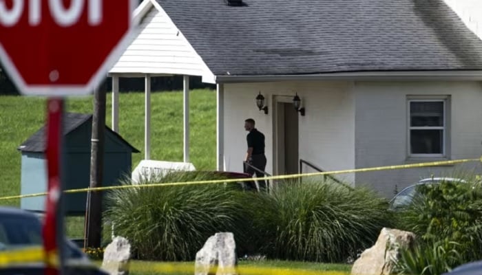 Polisi menilai tempat kejadian setelah penembakan di Gereja Baptis Richmond Road pada 13 Jul 2025, di Lexington, Kentucky, AS. —Afp