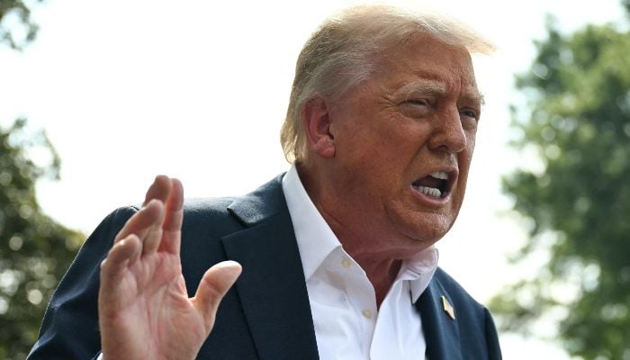 US President Donald Trump speaks to the press before boarding Marine One on the South Lawn of the White House in Washington, DC, on July 11, 2025. — AFP