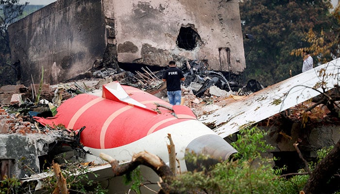 A firefighter stands next to the crashed Air India Boeing 787-8 Dreamliner aircraft, in Ahmedabad, India, June 13, 2025. — Reuters