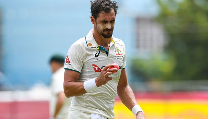 Mitchell Starc of Australia looks at the ball during the second day of the 3rd Test between West Indies and Australia at Sabina Park in Kingston, Jamaica, on July 13, 2025. — AFP